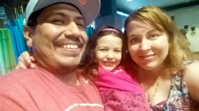 Melissa Varela, her husband Mitchell Varela and their daughter Vivian, who was killed in a 2015 car accident.