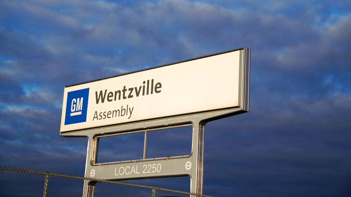 This March 24, 2021, file photo shows a sign near an entrance to a General Motors assembly plant in Wentzville, Mo. Face masks will be optional for U.S. union auto workers, as long as their factories are in counties that are not at high risk for the novel coronavirus. A task force of officials from Ford, General Motors, Stellantis and the United Auto Workers union decided to drop a mask requirement at a meeting on Thursday, March 3, 2022.