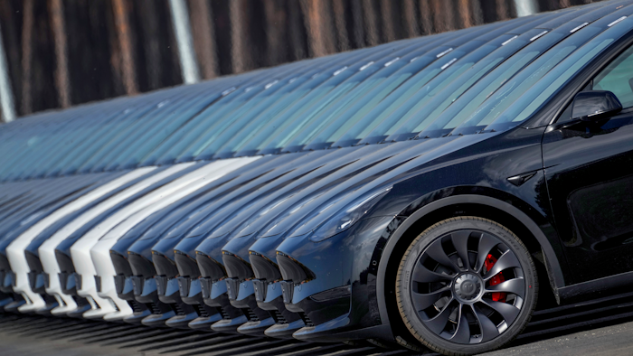 Tesla cars are parked at the construction site of the new Tesla Gigafactory for electric cars in Gruenheide near Berlin, Germany, Friday, March 18, 2022.