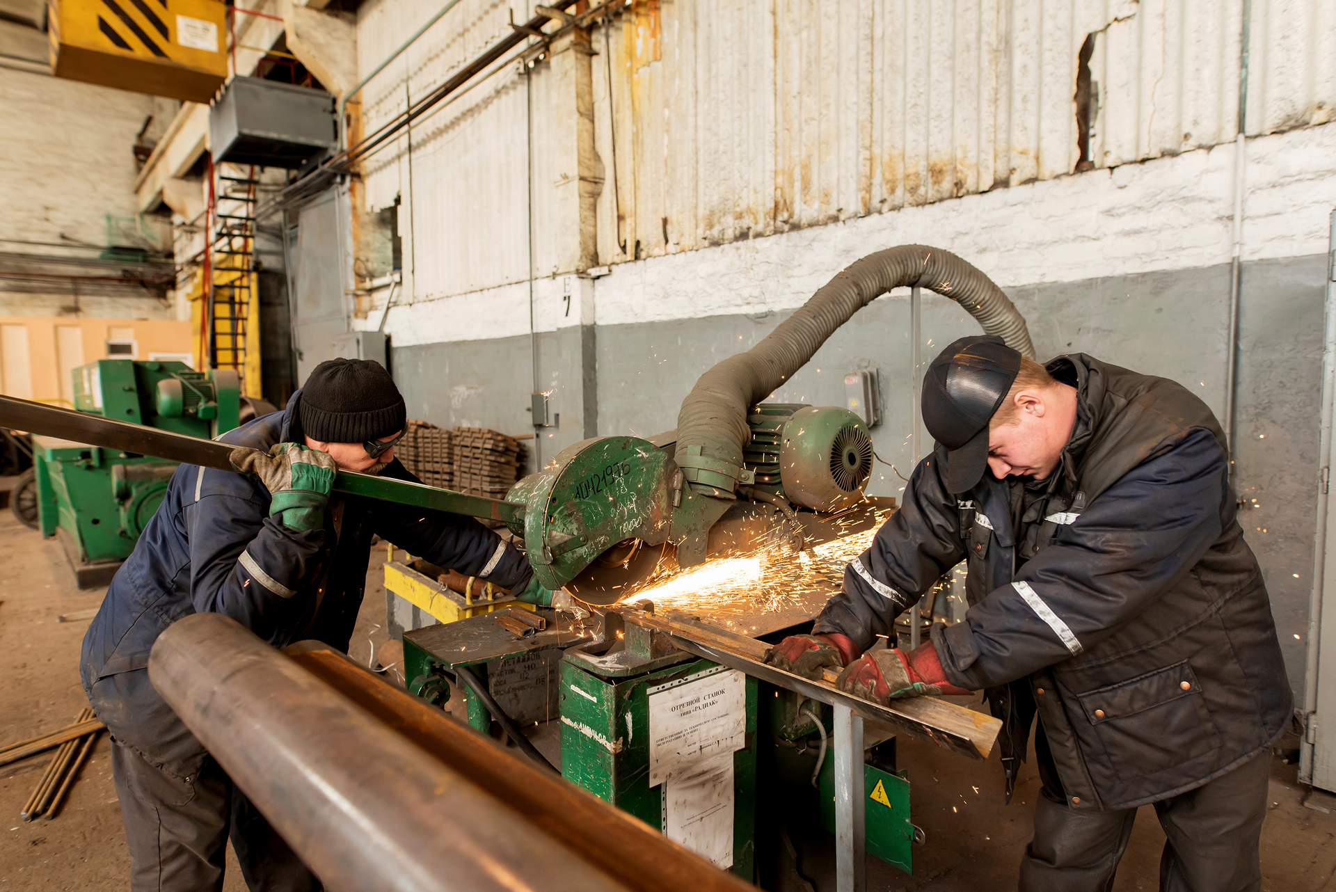 Two workers weld metal inside the Interpipe Steel plant in Dnipro, Ukraine, Thursday, March 10, 2022.