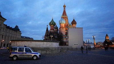 A police car is parked in Red Square, with St. Basil's Cathedral in the background, in Moscow, Russia, on March 4, 2022.