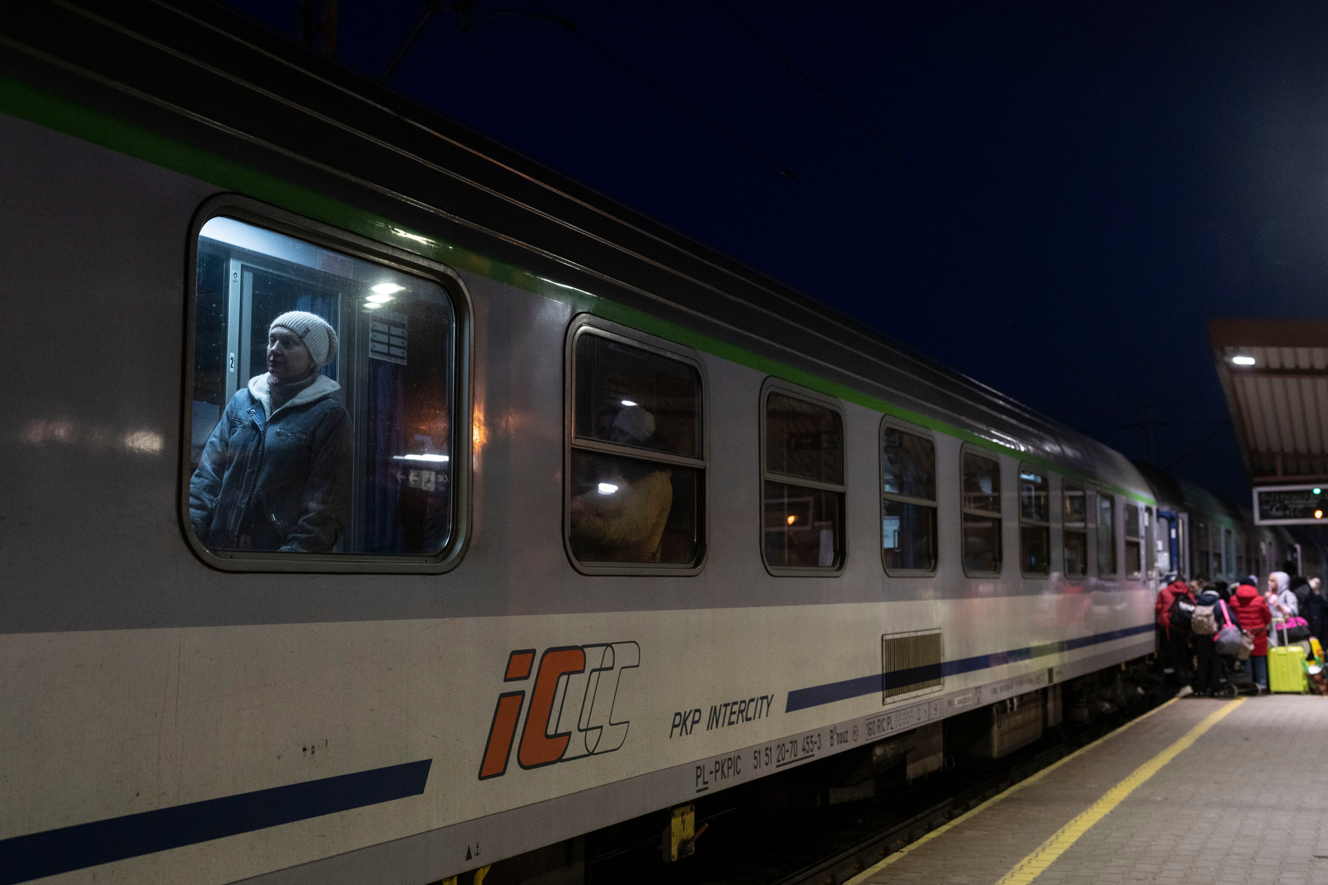 Ukrainian refugees embark a train bound to Warsaw at the Przemysl train station, southeastern Poland, March 11, 2022.