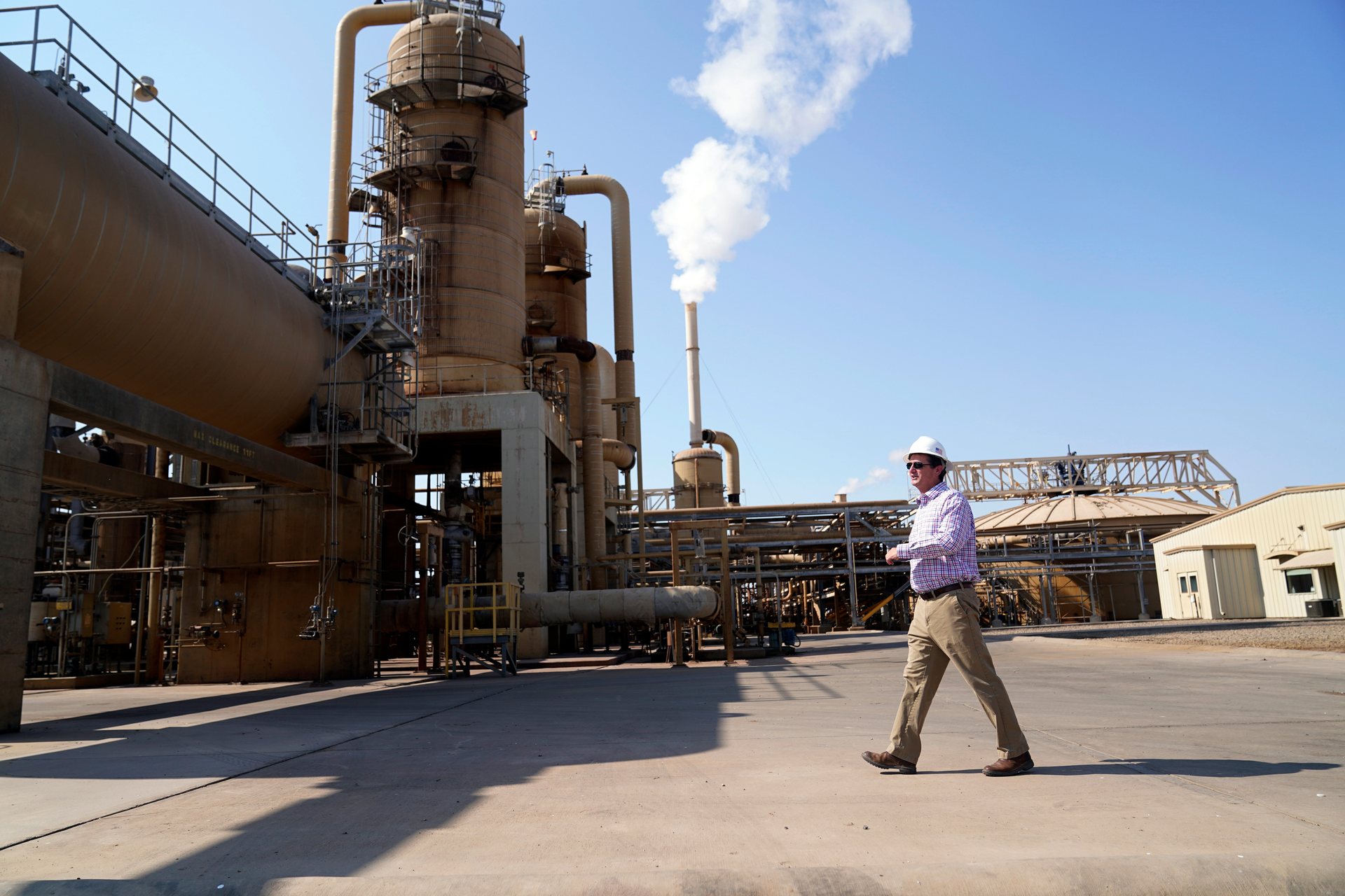 Derek Benson, chief operating officer of EnergySource Minerals, walks through the Featherstone plant in Calipatria, Calif., where the company is producing geothermal energy and extracting lithium from brine Friday, July 16, 2021. Benson says EnergySource Minerals has extracted lithium there on a small scale since 2016 and the company has plans to build a much larger addition for mineral extraction.