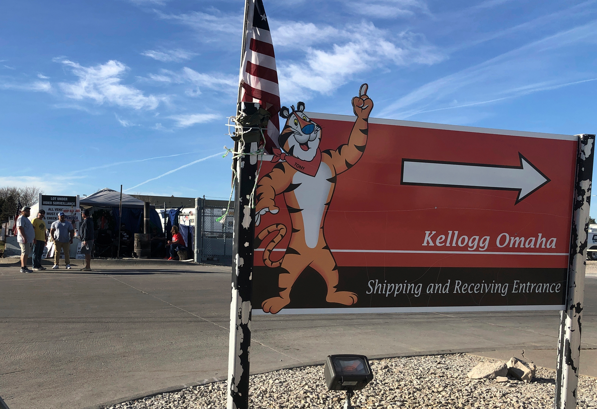 Striking Kellogg's workers stand outside the company's cereal plant in Omaha, Neb., on Dec. 2, 2021. Several hundred workers at a Kellogg's plant that makes Cheez-Its won a new contract, Wednesday, March 30, 2022, that delivers more than 15% wage increases over three years after 1,400 workers at the company's cereal plants went on strike for nearly three months last fall.
