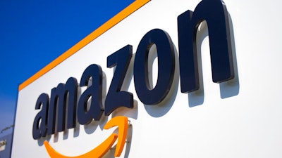 This April 16, 2020 shows the Amazon logo in Douai, northern France. A federal labor board is seeking the reinstatement of an Amazon employee who was fired after leading a protest in the early days of the pandemic calling for the company to do more to protect workers against COVID-19.