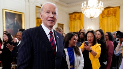 President Joe Biden departs after speaking an event to celebrate Equal Pay Day and Women's History Month in the East Room of the White House, Tuesday, March 15, 2022, in Washington.