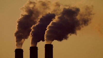 Emissions rise from the smokestacks at the Jeffrey Energy Center coal power plant as the suns sets, near Emmett, Kan., Sept. 18, 2021. The Environmental Protection Agency is proposing a federal plan that would restrict smokestack emissions from power plants and other industrial sources that burden downwind areas with air pollution they can't control.