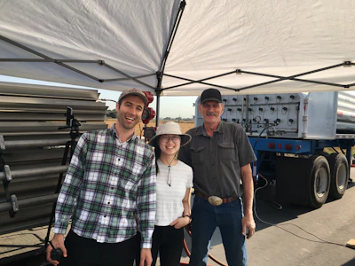 From left, researchers Evan Sherwin and Yuanlei Chen with equipment operator Jeff Gamble in the Permian Basin.