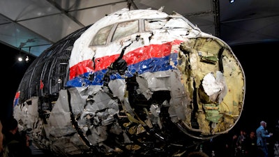 This Tuesday, Oct. 13, 2015 file photo, shows the reconstructed wreckage of Malaysia Airlines Flight MH17, put on display during a press conference in Gilze-Rijen, central Netherlands. The Dutch and Australian governments on Monday, March 14, 2022, have launched a legal case against Russia at the International Civil Aviation Organization seeking to hold Moscow accountable for its alleged role in the downing of Malaysia Airlines flight MH17.