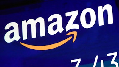 The logo for Amazon.com Inc. is displayed on a screen at the Nasdaq MarketSite, July 27, 2018. House lawmakers have made good on their threat to seek a criminal investigation of Amazon, asking the Justice Department Wednesday to investigate whether Amazon and its senior executives obstructed Congress or violated other laws in testimony on the tech giant’s competition practices. The bipartisan battle against the world’s biggest online retailer by the House Judiciary Committee escalated with the letter to Attorney General Merrick Garland referring the case for a criminal inquiry.