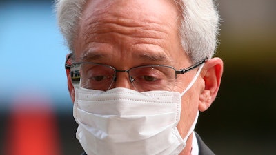 Greg Kelly, former executive of Japanese automaker Nissan, walks in to the Tokyo District Court in Tokyo Thursday, March 3, 2022.