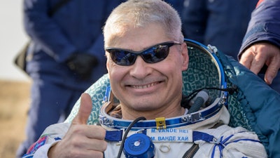 NASA astronaut Mark Vande Hei gives the thumbs up outside the Soyuz MS-19 spacecraft after he landed with Russian cosmonauts Anton Shkaplerov and Pyotr Dubrov in a remote area near the town of Zhezkazgan, Kazakhstan on Wednesday, March 30, 2022.