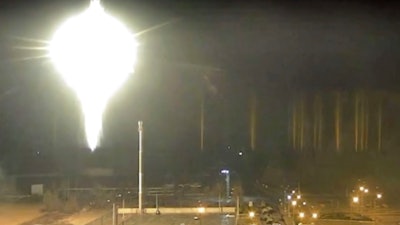 This image made from a video released by Zaporizhzhia nuclear power plant shows bright flaring object landing in grounds of the nuclear plant in Enerhodar, Ukraine Friday, March 4, 2022. Russian forces shelled Europe’s largest nuclear plant early Friday, sparking a fire as they pressed their attack on a crucial energy-producing Ukrainian city and gained ground in their bid to cut off the country from the sea.