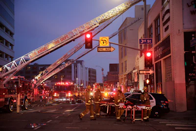 Los Angeles Fire Department firefighters work the scene of a structure fire that injured multiple firefighters, May 16, 2020. The owner of a downtown Los Angeles building where an explosion injured 12 firefighters has been allowed to enter a judicial diversion program that allows him to avoid jail time. A court commissioner on Wednesday, March 30, 2022, granted Steve Sungho Lee's request to enter the two-year program.