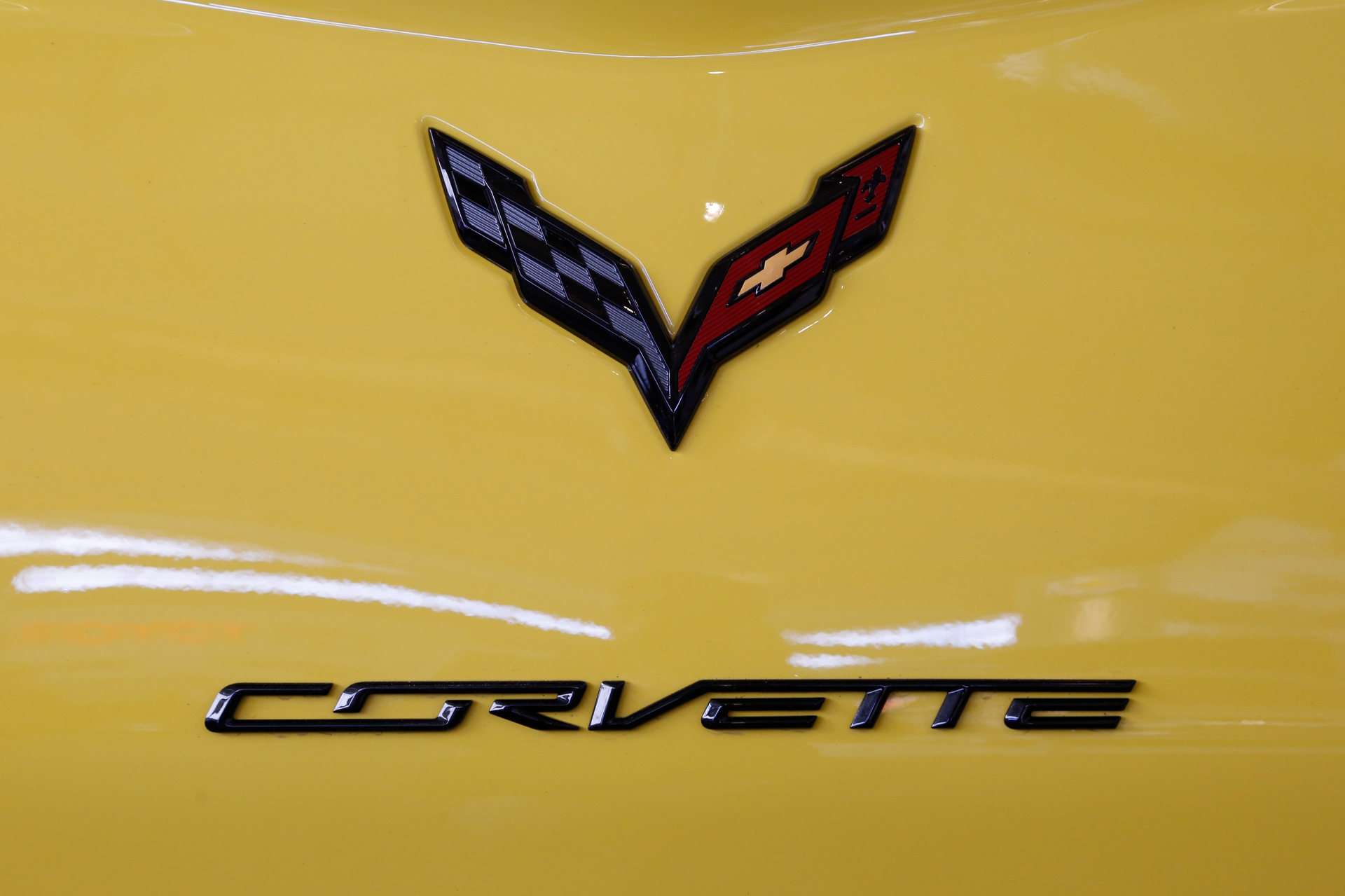 This is a the logo on the rear of a 2016 Corvette on display at the Pittsburgh International Auto Show in Pittsburgh, Feb. 11, 2016. General Motors says it will be offering an electrified Corvette as early as next year as it continues to strengthen its foothold in the electric vehicle market. President Mark Reuss said in a statement on LinkedIn on Monday, April 25, 2022 that the automaker will also offer a fully electric, Ultium-based Corvette in the future.