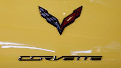 This is a the logo on the rear of a 2016 Corvette on display at the Pittsburgh International Auto Show in Pittsburgh, Feb. 11, 2016. General Motors says it will be offering an electrified Corvette as early as next year as it continues to strengthen its foothold in the electric vehicle market. President Mark Reuss said in a statement on LinkedIn on Monday, April 25, 2022 that the automaker will also offer a fully electric, Ultium-based Corvette in the future.