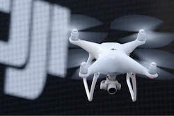 A Phantom 4, developed by major Chinese consumer-drone maker DJI, flies during its demonstration flight in Tokyo, Thursday, March 3, 2016. Drone company DJI Technology Co said Tuesday, April 27, 2022, that it has temporarily suspended business activities in Russia and Ukraine to prevent use of its drones in combat, in a rare case of a Chinese company pulling out of Russia.