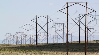 This May 20, 2012 file photo shows one of the major transmission lines that runs to the west of Albuquerque, N.MThe federal government has finished another environmental review of a proposed transmission line that will carry wind-generated electricity from rural New Mexico to big cities in the West and similar reviews are planned for two more projects that would span parts of Utah and Nevada, the U.S. Interior Department announced Thursday, April 28, 2022.