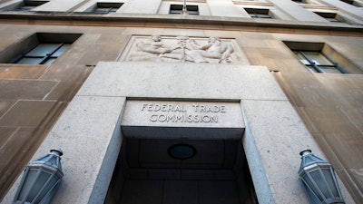 This Jan. 28, 2015, file photo shows the Federal Trade Commission building in Washington. Walmart and Kohl's are paying a combined $5.5 million in settlements after the Federal Trade Commission said they falsely marketed dozens of sheets and other home textile products as made of environmentally friendly bamboo, when they were actually rayon.