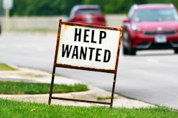 A help wanted sign is displayed at a gas station in Mount Prospect, Ill., Tuesday, July 27, 2021. Fewer Americans applied for unemployment benefits last week as layoffs remain at historically low levels. Jobless claims fell by 5,000 to 166,000 for the week ending April 2, 2022 the Labor Department reported Thursday.