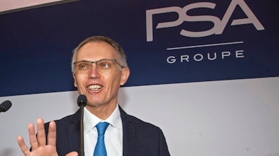 In this Feb. 26, 2020 file photo, CEO of PSA Groupe Carlos Tavares arrives for the presentation of the company's 2019 full year results in Rueil-Malmaison, west of Paris. Reports of Stellantis CEO Carlos Tavares’ remuneration package of 19.15 million euros during Stellantis’ first year of existence, not counting long-term incentives, caused waves on as Macron and Le Pen campaigned ahead of the April 24 runoff vote. Polls show purchasing power and inflation are a top voter concern. Centrist President Emmanuel Macron, perceived by many voters as being too pro-business, called the pay package “astronomical” and pushed for a Europe-wide effort to set ceilings on “abusive” executive pay.