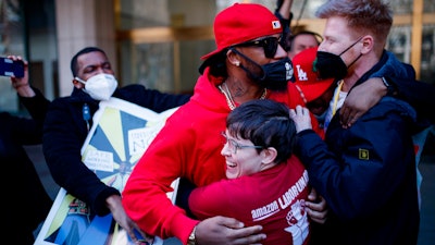 Staten Island based Amazon.com Inc distribution center union organizer Chris Smalls celebrates with union members after getting the voting results to unionize Amazon warehouse on Staten Island, N.Y., Friday, April 1, 2022, in the Brooklyn borough of New York.