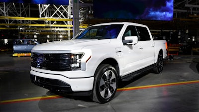 A Ford F-150 electric truck is displayed at the Rouge Electric Vehicle Center, Tuesday, April 26, 2022, in Dearborn, Mich.