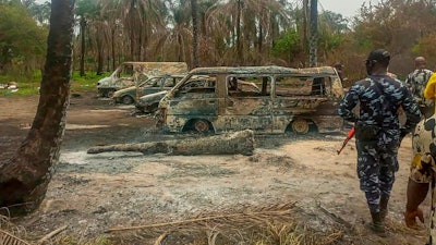 At least 100 people are feared to have died in the explosion, authorities told The Associated Press, as the search for bodies at the site and for two people suspected of being involved in the incident intensified.