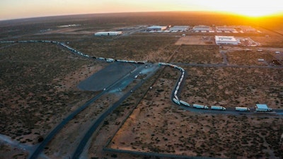 Truckers block the entrance into the Santa Teresa Port of Entry in Ciudad Juarez going into New Mexico on April 12, 2022. The truckers blocked the port as a protest to the prolonged processing times implemented by Gov. Abbott which they say have increased from 2-3 hours up to 14 hours in the last few days.