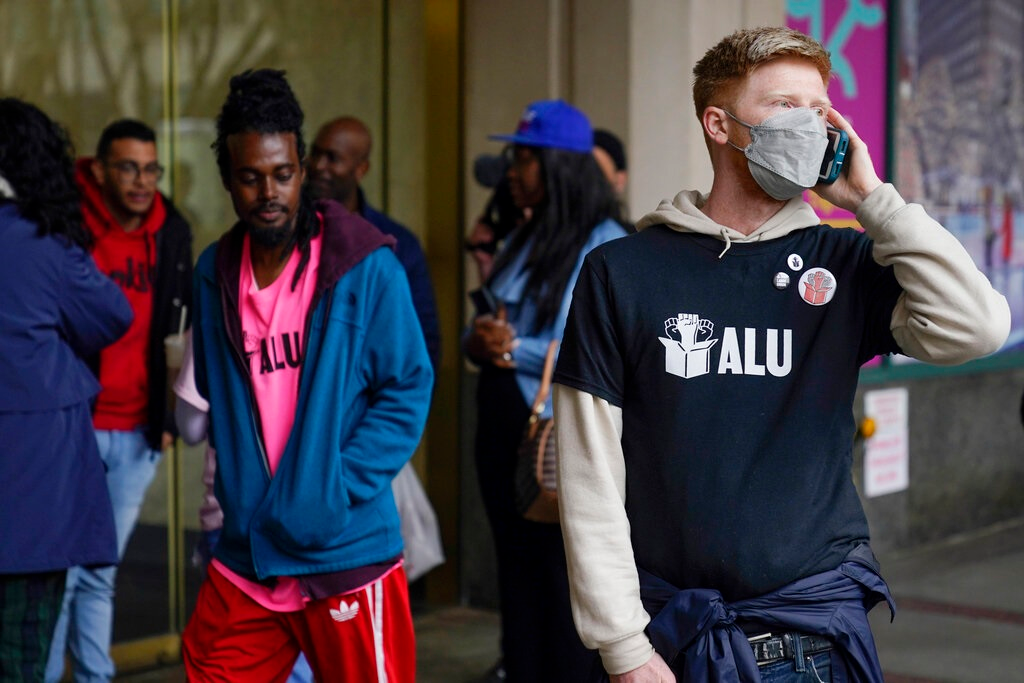Members and supporters of the Amazon Labor Union stand outside an office of the National Labor Relations Board after a count of votes for unionization was concluded in New York, Monday, May 2, 2022.