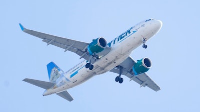 A Frontier Airlines aircraft flying over Gloster City, N.J., approaches Philadelphia International Airport, Oct. 22, 2021. Spirit Airlines' board still supports Frontier Airlines' $2.9 billion takeover bid for the airline, saying it determined JetBlue's competing $3.6 billion offer isn't a superior proposal. Last month Spirit said that after speaking with financial and legal advisers, its directors believed JetBlue’s offer could “reasonably” turn out to be the better of the two deals. But on Monday, May 2, 2022 the company announced that it was determined that JetBlue's offer “is not reasonably capable of being consummated.'