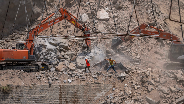 An official in Indian-controlled Kashmir said Friday that 10 workers were trapped after part of a road tunnel collapsed in the Himalayan region.