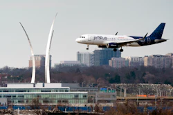 A JetBlue passenger flight lands at Reagan Washington National Airport in Arlington, Va., across the Potomac River from Washington, Wed., Jan. 19, 2022. On Friday, June 17, 2022, federal regulators said Verizon and AT&T will delay part of their 5G rollout near airports to give airlines more time to ensure that equipment on their planes is safe from interference from the wireless signals, but the airline industry is not happy about the deal.