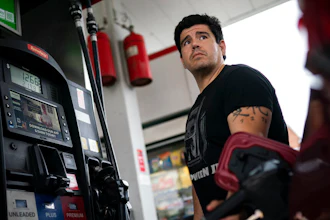 Wallace Reid fuels his vehicle he drives to make a living using ride-share apps, Wednesday, June 22, 2022, in the Queens borough of New York. Millions of Americans who rely on their cars for work are changing their habits, signing up for carpools or even ditching their cars for bicycles as gas prices recently hit $5 per gallon for the first time ever.