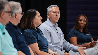 Dave Nowicki and other Ford Motor Co. team members speak during a panel discussion on the automaker's planned electric truck factory, at Haywood High School, Tuesday, June 21, 2022, in Brownsville, Tenn.