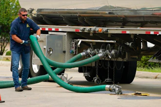 A gas tank driver adjusts his hose hookup to an underground tank on May 24, 2022, in Jackson, Miss. High diesel prices are driving up the cost of most goods, from groceries to Amazon orders and furniture, as nearly everything that is delivered, whether by truck, rail or ship, uses diesel fuel. Truckers are turning down hauling jobs in the states with the most expensive diesel.