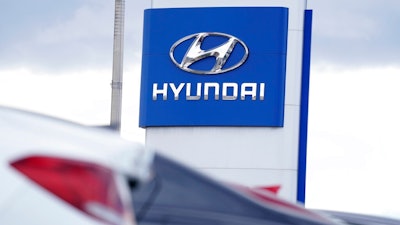 The Hyundai company logo hangs over a long row of cars at a car dealership in Centennial, Colo., Sunday, Dec. 20, 2020. Georgia officials are close to finalizing a deal with the automaker to build a $5.5 billion electric car plant near Savannah, Ga. An economic development agency representing four Savannah-area counties approved its portions of the agreement Tuesday, July 19, 2022, including an economic incentives package.