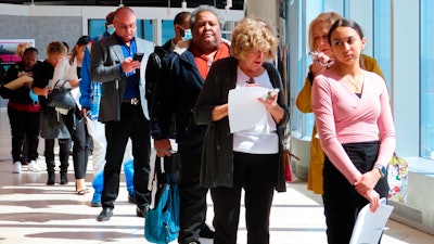 Applicants line up at a job fair at the Ocean Casino Resort in Atlantic City N.J., on April 11, 2022. Applications for jobless aid for the week ending July 9 rose by 9,000 to 244,000, up from the previous week's 235,000, the Labor Department reported Thursday, July 14, 2022. First-time applications generally reflect layoffs. Analysts had expected the number to remain flat from the previous week.