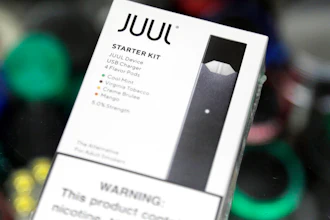 This Thursday, Dec. 20, 2018 file photo shows a Juul electronic cigarette starter kit at a smoke shop in New York. Altria reports its nearly $13 billion investment in troubled vaping company Juul is worth 95% less than it originally paid. The tobacco giant on Thursday, July 28, 2022, said its stake in the e-cigarette maker is now worth less than $500 million after U.S. regulators announced plans to ban Juul's vaping devices.