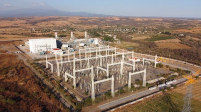 A newly built power generation plant that is part of a mega-energy project is seen with the Popocatepetl Volcano in the background near Huexca, Morelos state, Mexico, on Feb. 22, 2020. The United States is putting pressure on Mexico over energy policies that Washington says unfairly favor Mexico's state-owned electricity and oil companies over American competitors and clean-energy suppliers. The U.S. is demanding talks to resolve the dispute, starting a process Wednesday, July 20, 2022, that could end in trade sanctions against Mexico.