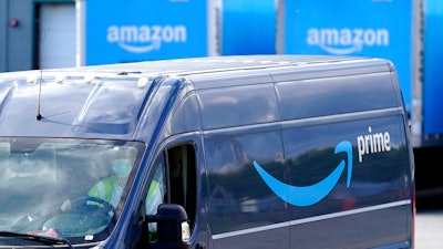 An Amazon Prime logo is seen on the side of a delivery van as it departs an Amazon Warehouse location on Oct. 1, 2020, in Dedham, Mass. Amazon will be offering discounts on a variety of items during its two-day Prime Day shopping event that began Tuesday, July 12, 2022. Consumers are searching for the best deals they can find, including time-sensitive deals that are offered on the site for a short period of time.