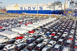Cars and trucks for export are parked at a port in Yantai in eastern China's Shandong Province, Tuesday, Jan. 4, 2022. China’s monthly trade surplus soared to a record $97.9 billion in June as export growth accelerated following the easing of anti-virus controls that temporarily shut down Shanghai and disrupted trade.