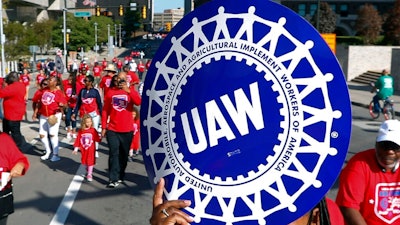 United Auto Workers members walk in the Labor Day parade in Detroit, Sept. 2, 2019. The United Auto Workers union is increasing the strike pay it offers workers who walk off the job for the second time this year in 2022, following a spate of strikes amid the ongoing worker shortages nationwide.