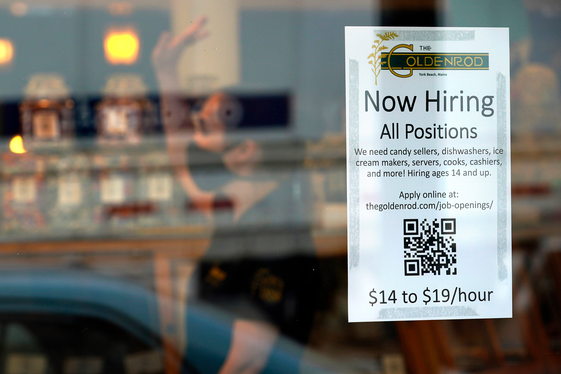Sign advertising for help at The Goldenrod restaurant and candy shop, York Beach, Maine, June 1, 2022.