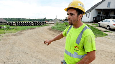 Taylor Purdy, a pipe layer with Complete General Construction, answers questions about his experience working around the new Intel semiconductor manufacturing plant construction site in Johnstown, Ohio.