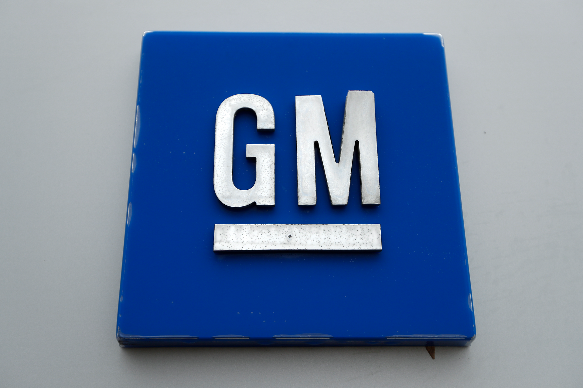 A General Motors logo is displayed outside the General Motors Detroit-Hamtramck Assembly plant on Jan. 27, 2020, in Hamtramck, Mich. General Motors said Wednesday, Aug. 31, 2022, that a new electric vehicle battery plant built in Ohio has started producing cells, which could help customers get federal tax credits.