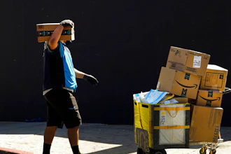 An Amazon worker delivers boxes in Los Angeles on Oct. 1, 2020. Amazon said Wednesday, Sept. 28, 2022, that it is raising its average starting pay for frontline workers from $18 to $19 a hour, a boost that could help it attract more employees in a tight labor market as the holiday season approaches.