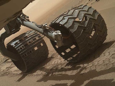 Rover Curiosity's wheels have been damaged over the years, leaving small pieces of aluminum behind.