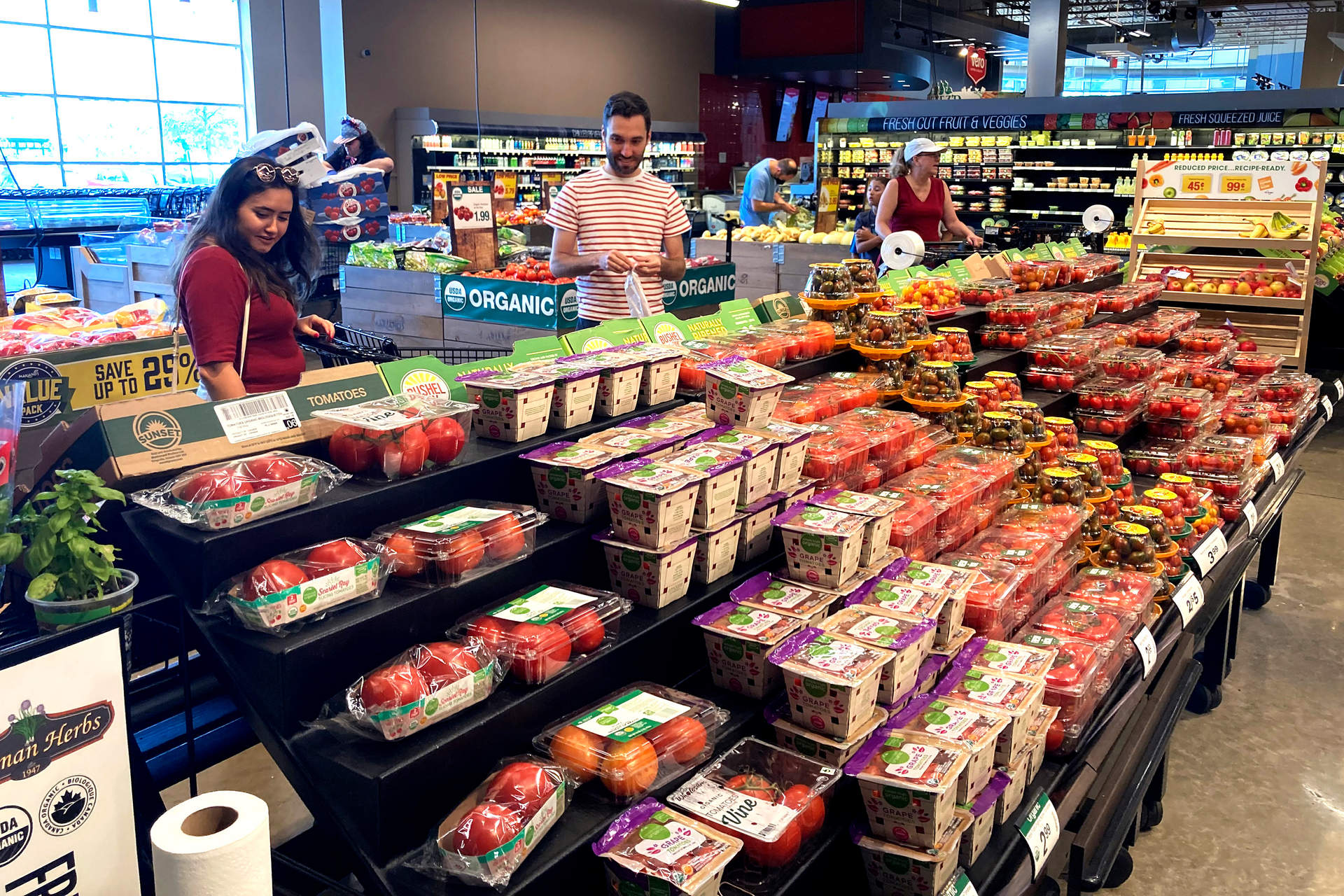 People shop at a grocery store in Glenview, Ill., July 4, 2022.