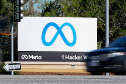 A car passes Facebook's new Meta logo on a sign at the company headquarters on Oct. 28, 2021, in Menlo Park, Calif.